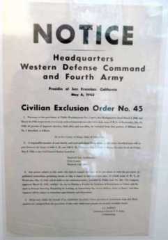 {U.S. government notices to American citizens or aliens of Japanese ancestry in May 1942 that they must move to internment camps. (Photograph by Dorothea Lange.)}