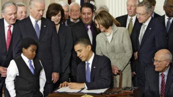 {Obama Signs Health care Bill}
